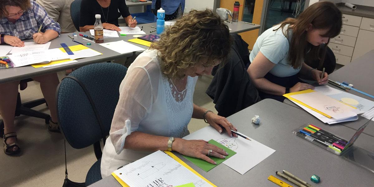 AACC Students participating in a creative lettering class.