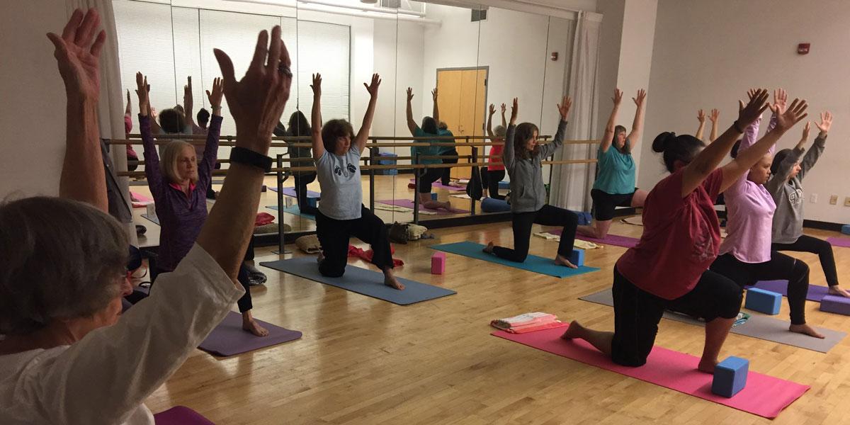 AACC students participating in yoga.